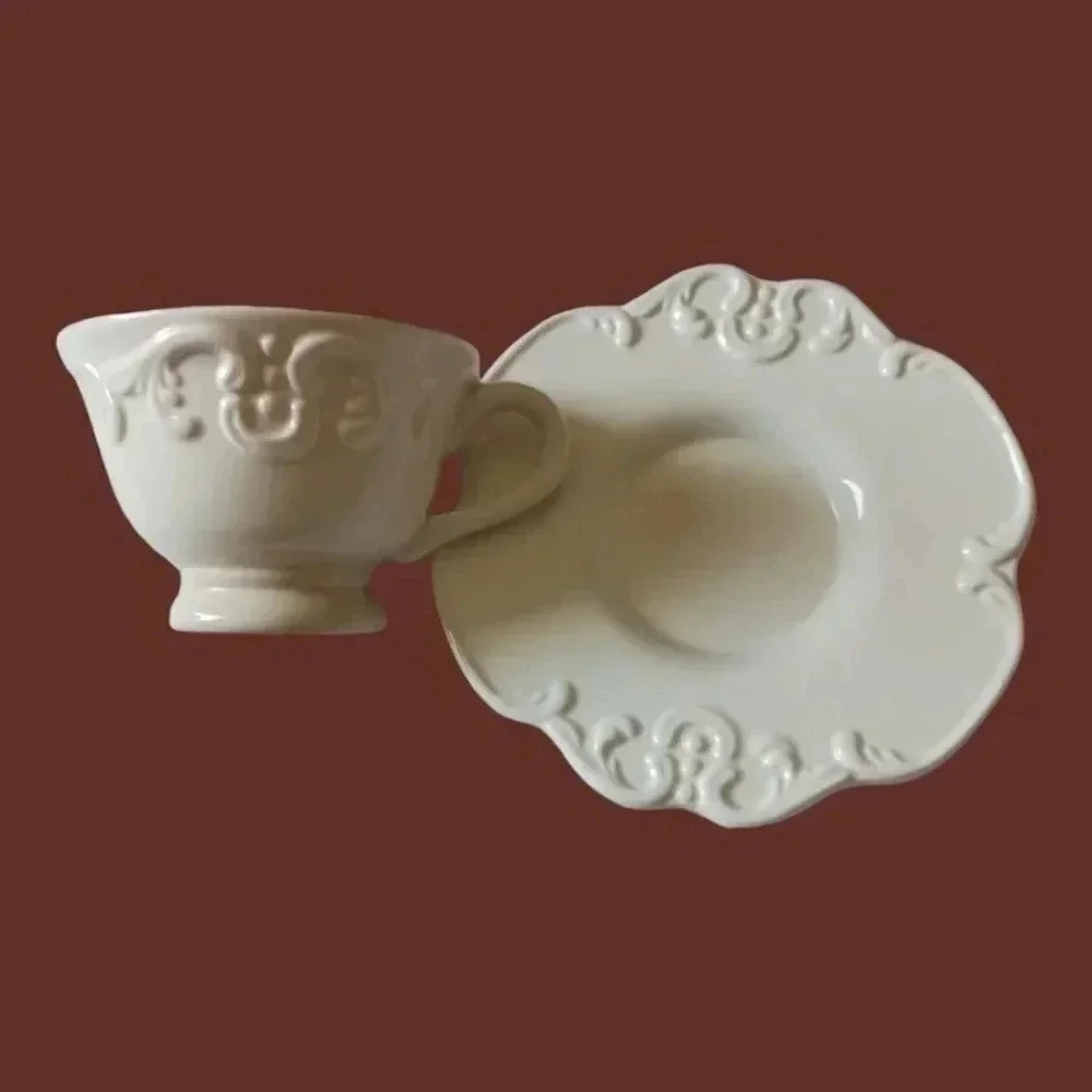 Shabby chic porcelain teacup and saucer